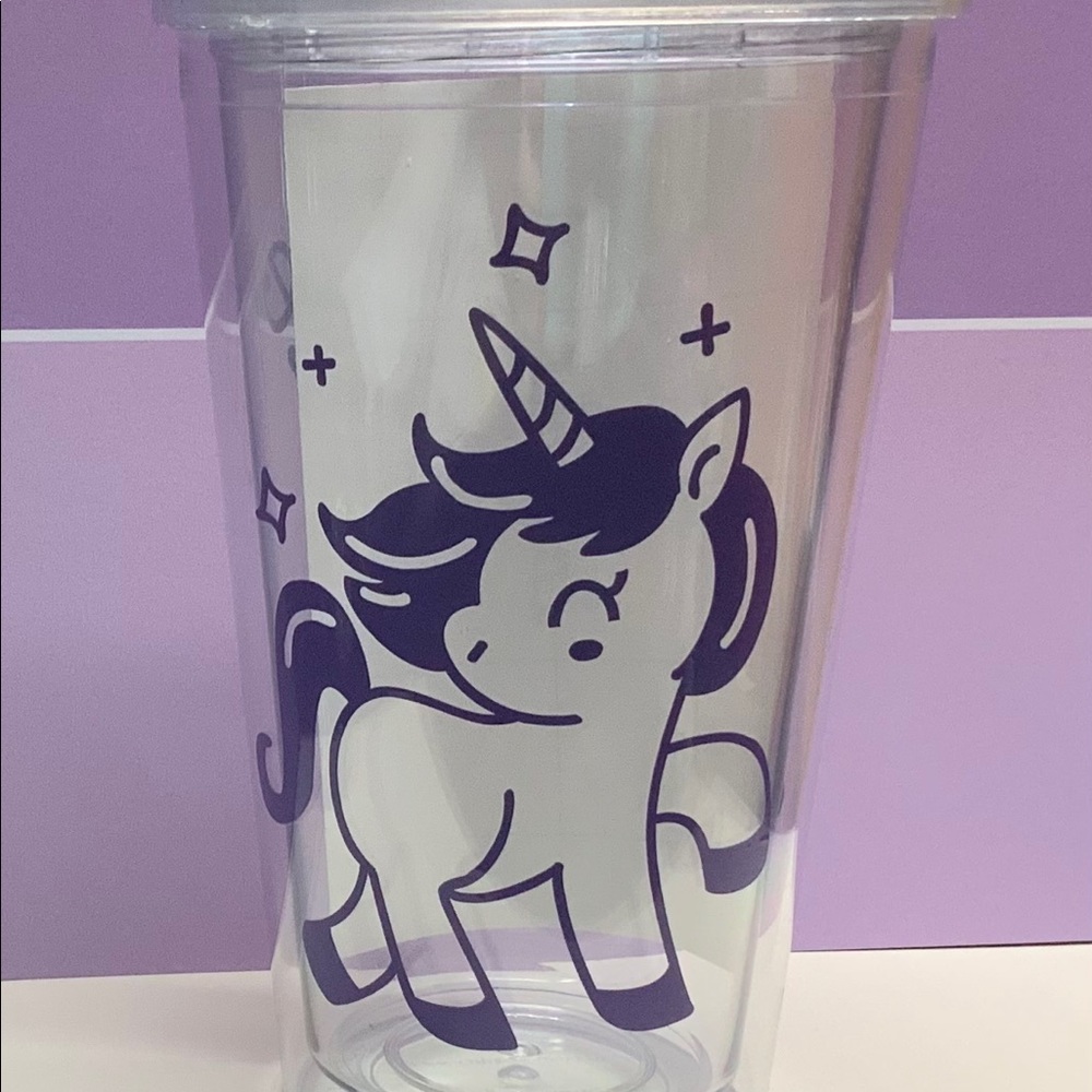 Tumbler with straw.